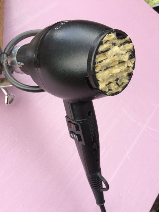 Image of  an unhealthy dryer, keep it clean for BETTER HAIR.
